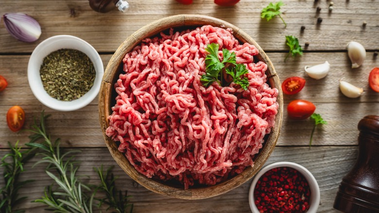 ground beef and spices on a wooden table